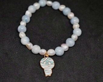 Pulsera de cuentas de cristal con dije de momia de celestita Clarity