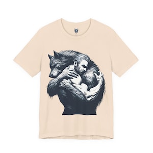 Blue shirt with black and white werewolf and handsome man hugging. Monster love. Gay werewolf lovers tshirt. For men who love werewolves. Anthro furry gay werewolf lover. Sexy male art on tshirt. Gay man and gay werewolf lovers embracing