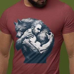 Shirt for lgbtq community. A man and werewolf embrace lovingly.