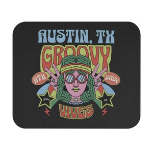 May include: Black square coaster with a retro design. The coaster features a woman with sunglasses and the words "Austin, TX Groovy Vibes." The design includes peace signs, stars, and the text "ATX Baby" and "Texas US."