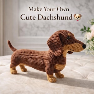 May include: A crocheted dachshund dog in shades of brown and tan. The dog has a long body, short legs, and floppy ears. The text "Make Your Own Cute Dachshund" is displayed above the dog.