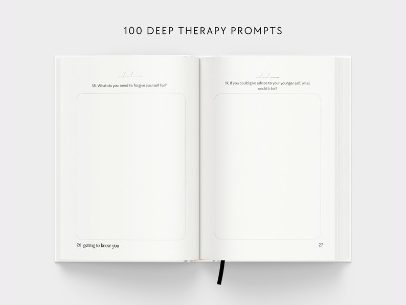 May include: An open book with white pages and black text. The book is titled "100 Deep Therapy Prompts". The text on the pages includes prompts for self-reflection, such as "What do you need to forgive yourself for?" and "If you could give advice to your younger self, what would it be?"