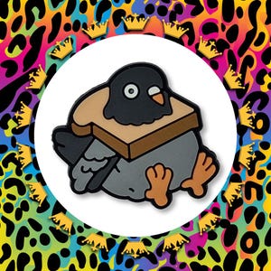 May include: A cartoon pigeon with a sandwich on its head, set against a white circle. The pigeon is grey, black, and orange, with a slice of brown bread. The background features a colourful leopard print and gold crowns.