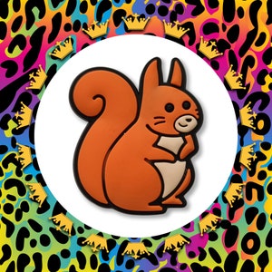 May include: A bright orange cartoon squirrel with a bushy tail, standing on its hind legs with its paws together. The squirrel is facing the right side of the image.