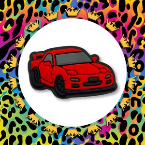 May include: A red sports car with black wheels and a black interior. The car is a popular model for car enthusiasts.