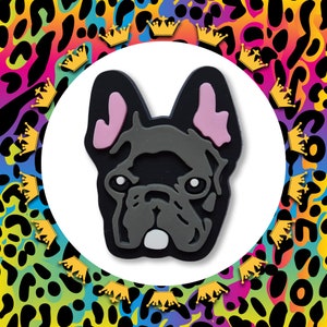 May include: A black and grey French bulldog figurine with pink ears. The figurine is in a cartoon style and has a friendly expression.