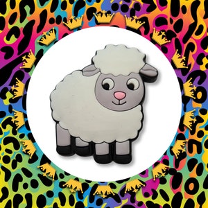 May include: A white fluffy sheep with a grey face and black hooves. The sheep is cartoon-like and has a friendly expression.