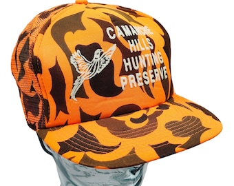 Boné Trucker Snapback Camuflado Laranja Camanche Hills Hunting Preserve Drystone