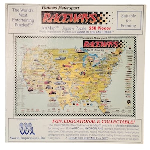 May include: A 550-piece ArtMap jigsaw puzzle titled "RACEWAYS" featuring a map of North America with racing locations. The puzzle includes text that says "FUN, EDUCATIONAL & COLLECTABLE!" and is suitable for framing.