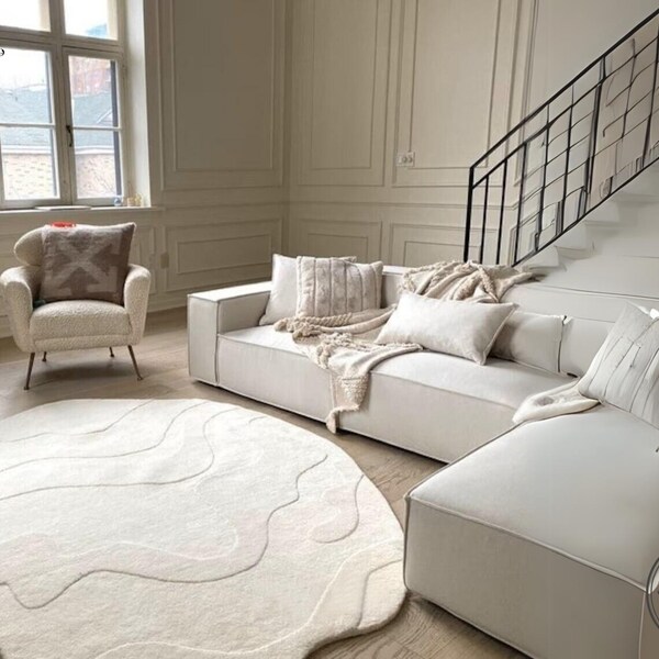 Tapis tendance Oliver blanc cassé de forme irrégulière, diamètre rond, touffe à la main, tapis moderne unique en laine, tapis de créateur pour salon, chambre à coucher