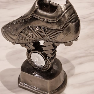 Personalised metal football boot trophy.  Suitable for soccer or GAA football. Ideal trophy, presentation item or gift.