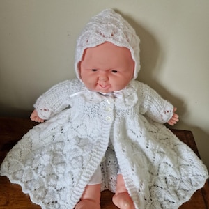 Matching white handknit matinee coat, boots and bonnet gift set for baby. Fits 3-6 months.