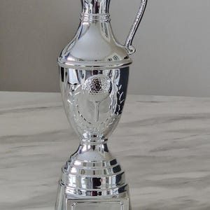 Personalized 30 cm silver cast resin claret jug golf cup trophy with a silver plated finish.
