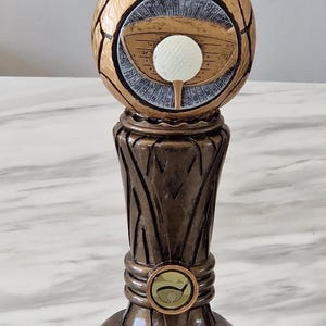 Personalised heavy 30 cm cast resin golf trophy with a carved wood look. Unique design. Great tournament trophy.