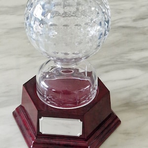 Personalised 24% lead Irish crystal golf ball trophy. Comes with a 6-sided walnut piano finish plinth. Ideal tournament golf prize