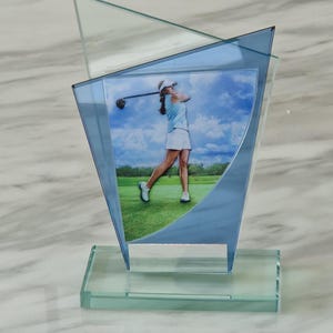 Personalised 16 cm blue and jade overlapping glass golf trophy with 3D curved image of female  golfer.