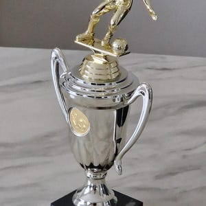 Personalised 28 cm silver & gold soccer player cup figurine trophy on black marble base. Ideal soccer football trophy, ornament or gift.