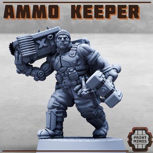 May include: A grey resin miniature figure titled AMMO KEEPER, depicting a muscular character with a cigar, carrying a large ammunition crate on one shoulder and a heavy mechanical tool in the other hand, featuring detailed tactical gear and armour.