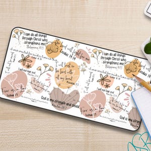 May include: A rectangular mousepad with a floral design and inspirational quotes. The design features soft pink, beige, and brown floral elements with various Bible verses and phrases. The mousepad has a black border and the text "Fear is a liar" is visible.