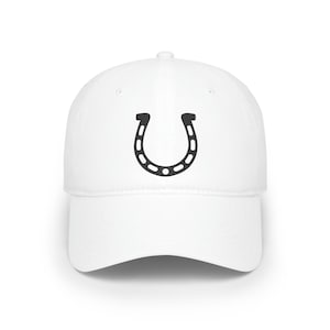 May include: A white baseball cap with a black horseshoe design on the front.