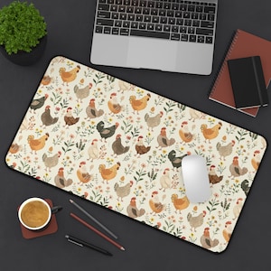 May include: A rectangular desk mat featuring a repeating pattern of chickens in various colors, interspersed with floral and leaf elements, set against a cream background. The mat has a black border and is designed for use with a computer mouse and keyboard.