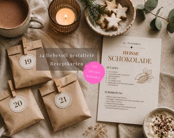 May include: Three brown paper bags with wooden clips and circular labels numbered 19, 20, and 21, alongside a recipe card titled Heisse Schokolade with text in German, a cup of hot cocoa, a lit candle, and a bowl of star-shaped cookies.