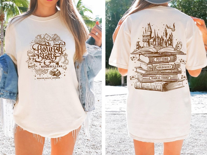May include: Two white t-shirts with different designs. The front shirt has a brown graphic of the text "Flourish and Blotts Booksellers Diagon Alley, London". The back shirt has a brown graphic of a stack of books with the text "Potions, Herbology, Magical Theory".