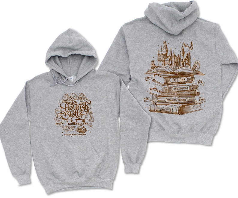 May include: A gray hoodie with a graphic of a stack of books and the text "Flourish and Blotts Booksellers" on the front. The back of the hoodie has a graphic of a stack of books with the text "Potions, Herbology, Magical Theory" on the spines.