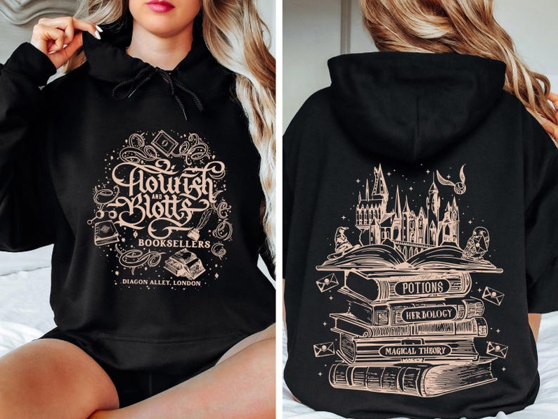 May include: Black hoodie with a gold graphic of the Hogwarts castle and a stack of books with the text "Potions", "Herbology", and "Magical Theory" on the back. The front of the hoodie has a gold graphic of the text "Flourish & Blotts Booksellers Diagon Alley London".