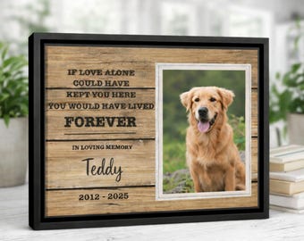 May include: A framed wooden memorial with a photo of a golden retriever. The frame includes the text "If love alone could have kept you here, you would have lived forever. In loving memory, Teddy 2012-2025."