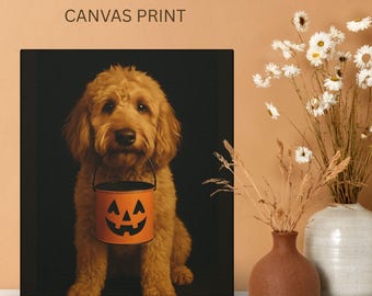 May include: Canvas print featuring a golden doodle dog holding an orange jack-o'-lantern bucket. The dog has a fluffy coat and is centered against a black background. The words "CANVAS PRINT" are at the top.