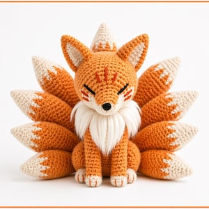 May include: A crocheted orange fox with nine tails, white accents, and closed eyes. The handmade plush toy features a fluffy white chest and detailed facial features, perfect for a nursery or as a decorative item.