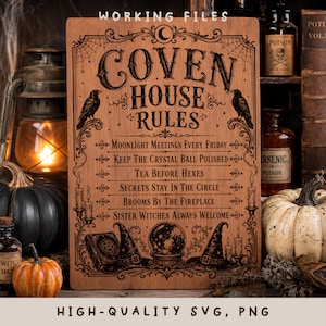 May include: A rectangular wooden sign featuring the engraved text COVEN HOUSE RULES and a list of six rules. The design includes illustrations of two ravens, a crystal ball, witch hats, candles, a book, and spiderwebs in a dark brown tone.