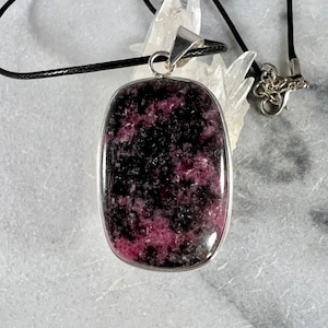 Rhodonite Pendant: Silver Plated Brass, 17in Leatherette Cord