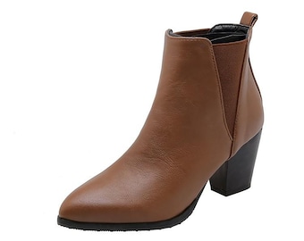 May include: Brown leather ankle boots with a pointed toe and a block heel.