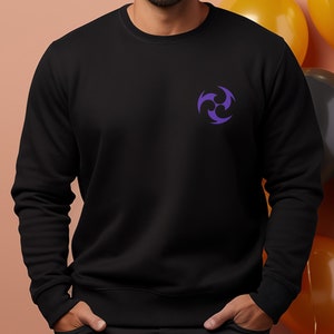 May include: A black sweatshirt with a purple three-pointed star design on the left chest.