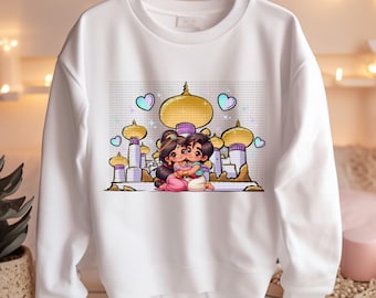 May include: White sweatshirt featuring a colorful graphic of a cartoon couple embracing in front of a golden-domed palace. The design includes pastel hearts and a whimsical style, perfect for fans of animated movies.