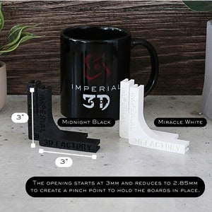 May include: Two 3-inch corner brackets, one black and one white, with the text "Imperial 3D" and "3D Factory" printed on them. The brackets are designed to hold boards together.