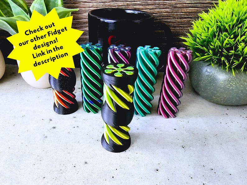 May include: Five colorful fidget toys made of plastic. The toys are in a spiral shape with different colors, including green, purple, and red.  Check out our other Fidget designs! Link in the description.
