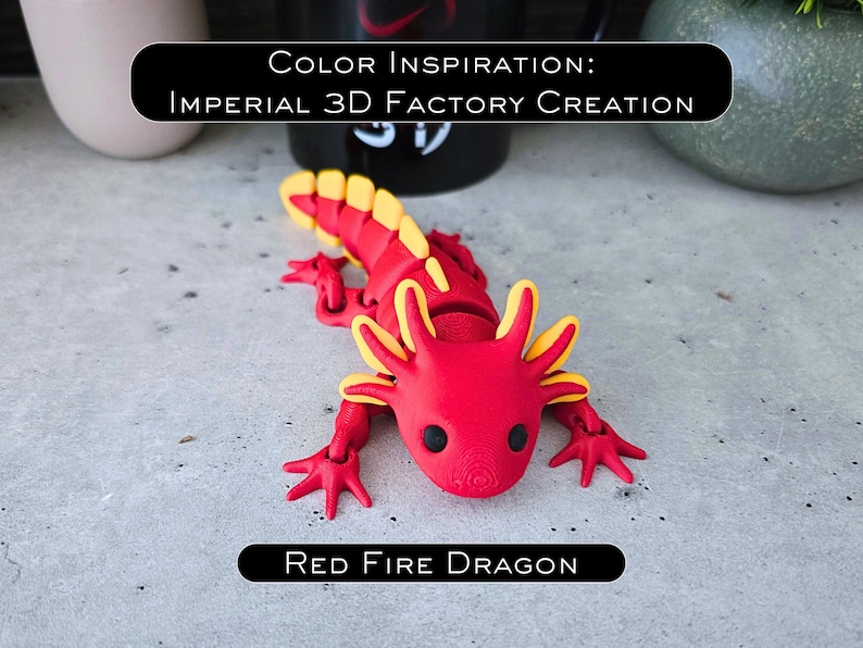 May include: A 3D printed articulated axolotl figure in red with yellow accents on the gills and tail fins. The figure features black eyes and a textured surface. Text on the image reads: COLOR INSPIRATION: IMPERIAL 3D FACTORY CREATION and RED FIRE DRAGON.