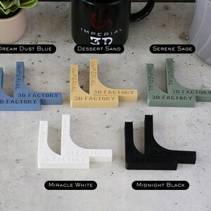 May include: Two sets of corner brackets in six different colors: dream dust blue, dessert sand, serene sage, miracle white, and midnight black. Each set has two brackets with the text "Imperial 3D Factory" printed on them.