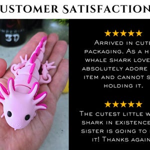 May include: A light pink articulated axolotl figure with dark pink accents on the gills and dorsal ridge. The image includes text: CUSTOMER SATISFACTION, five stars, ARRIVED IN CUTE PACKAGING. AS A HUGE WHALE SHARK LOVER, I ABSOLUTELY ADORE THIS ITEM AND CANNOT STOP HOLDING IT. THE CUTEST LITTLE WHALE SHARK IN EXISTENCE! MY SISTER IS GOING TO LOVE IT! THANKS AGAIN!!