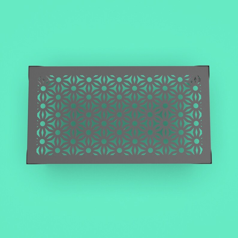 May include: A gray metal tray with a decorative cutout pattern of repeating flower shapes.