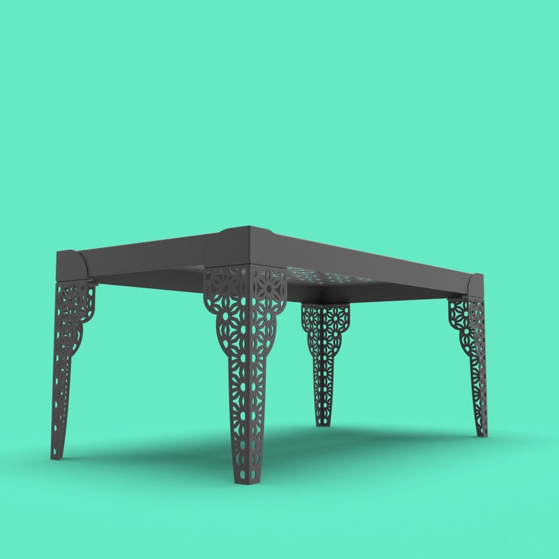 May include: A dark gray table with intricate cut-out designs on the legs. The table is made of metal and has a rectangular top.