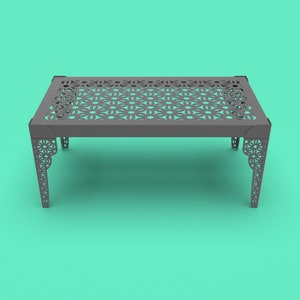 May include: A gray metal table with a geometric pattern cut out of the top. The table has a rectangular top and four legs.