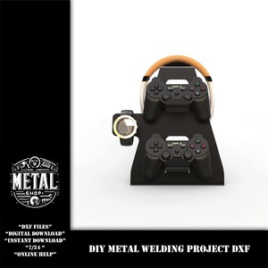 May include: DIY metal welding project DXF file for a video game controller stand. The stand features a steering wheel, two controller holders, and a watch holder. The stand is black with brown accents.
