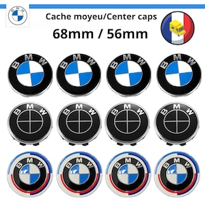 May include: Twelve BMW center caps, six with a black background and a blue and white logo, three with a black background and a black logo, and three with a black background and a blue, white, and red logo. The caps are 68mm in diameter and 56mm in diameter.