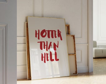 May include: A white framed canvas print with the text "HOTTER THAN HELL" in red lettering.