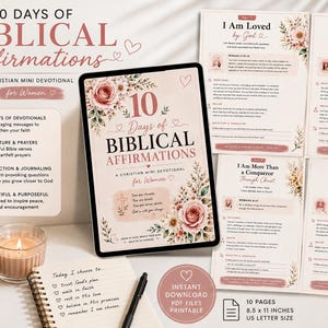May include: A digital tablet displaying a 10 Days of Biblical Affirmations devotional cover, surrounded by four printed pages of the devotional, a mug with the text Be still and know, a lit candle, and a notebook with a pen on a white surface.