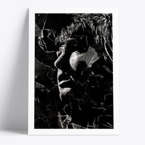 May include: Black and white art print featuring a profile of a person's face. The artwork is a collage of torn paper and textures, creating a dramatic and abstract effect. The print is framed in a white border.